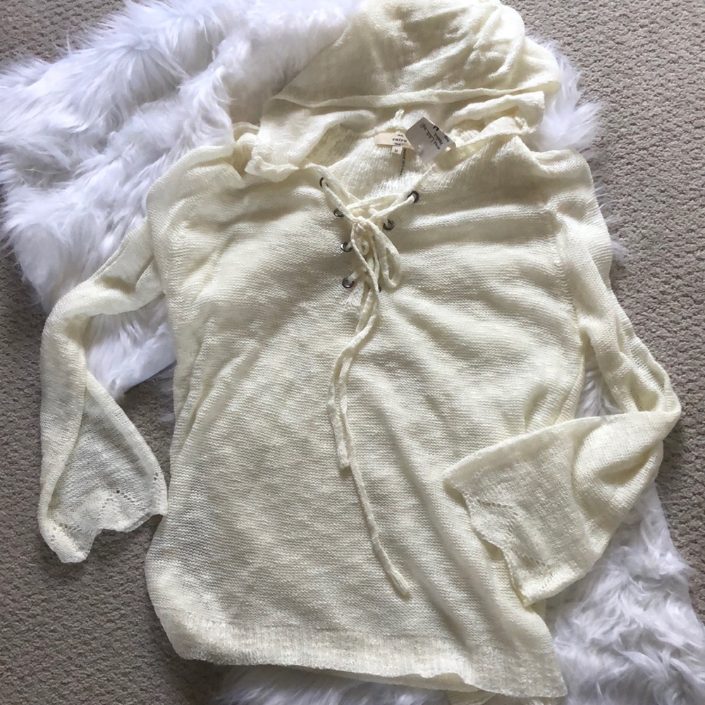 Light sweater with lace up front and hood